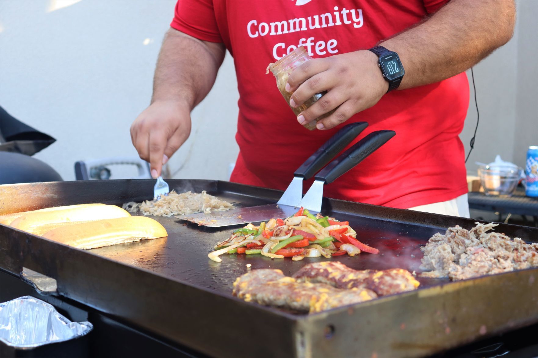 Blake Sykora preparing a Wisconsin cheese steak